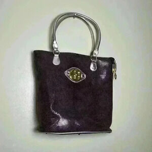 Iman brown and Gold Ladies hand bag.
